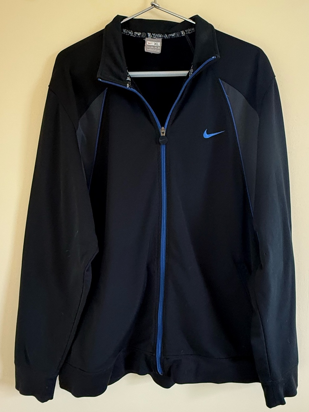 Nike Men’s Black Jacket with Blue Trim and Swoosh